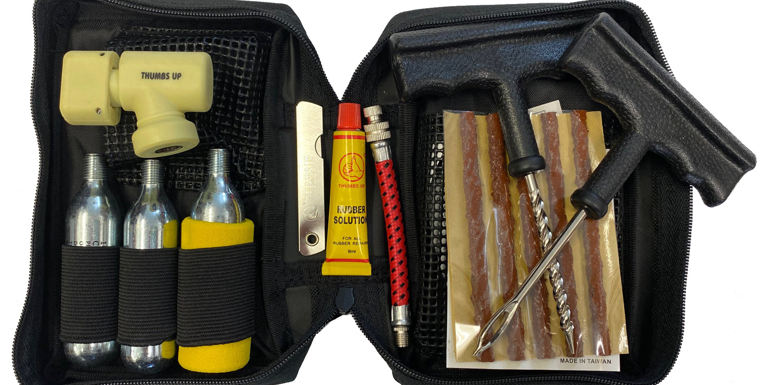 Dragon Stone tubeless tyre puncture repair kit and CO2 bottles in a black canvas carry case.