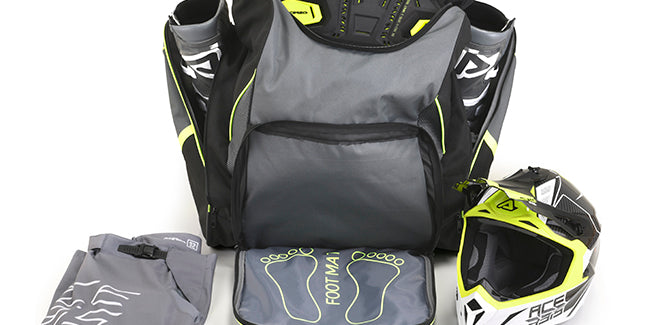 A grey Acerbis dirt bike back pack packed with protective gear